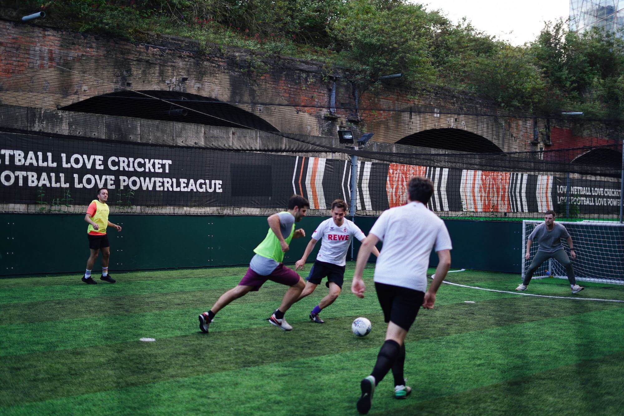 Five people playing football